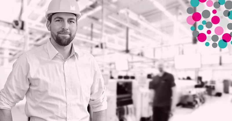 man in a factory with a hard hat on