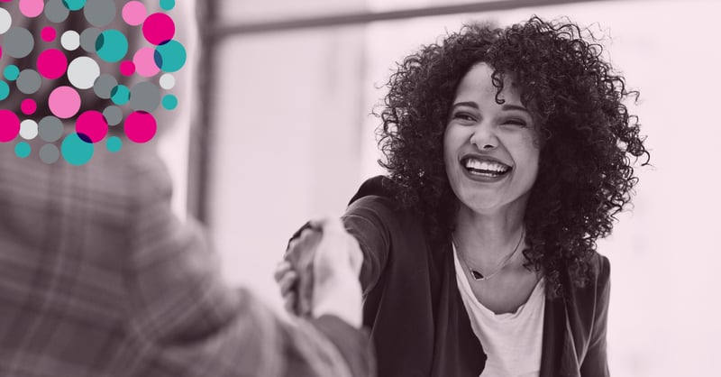 business woman smiling shaking hands